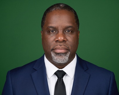 Studio-style AI headshot of the same customer, made with HeadshotPro