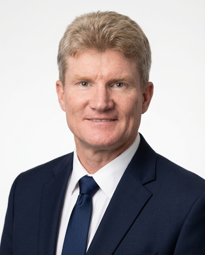 Studio-style AI headshot of the same customer, made with HeadshotPro